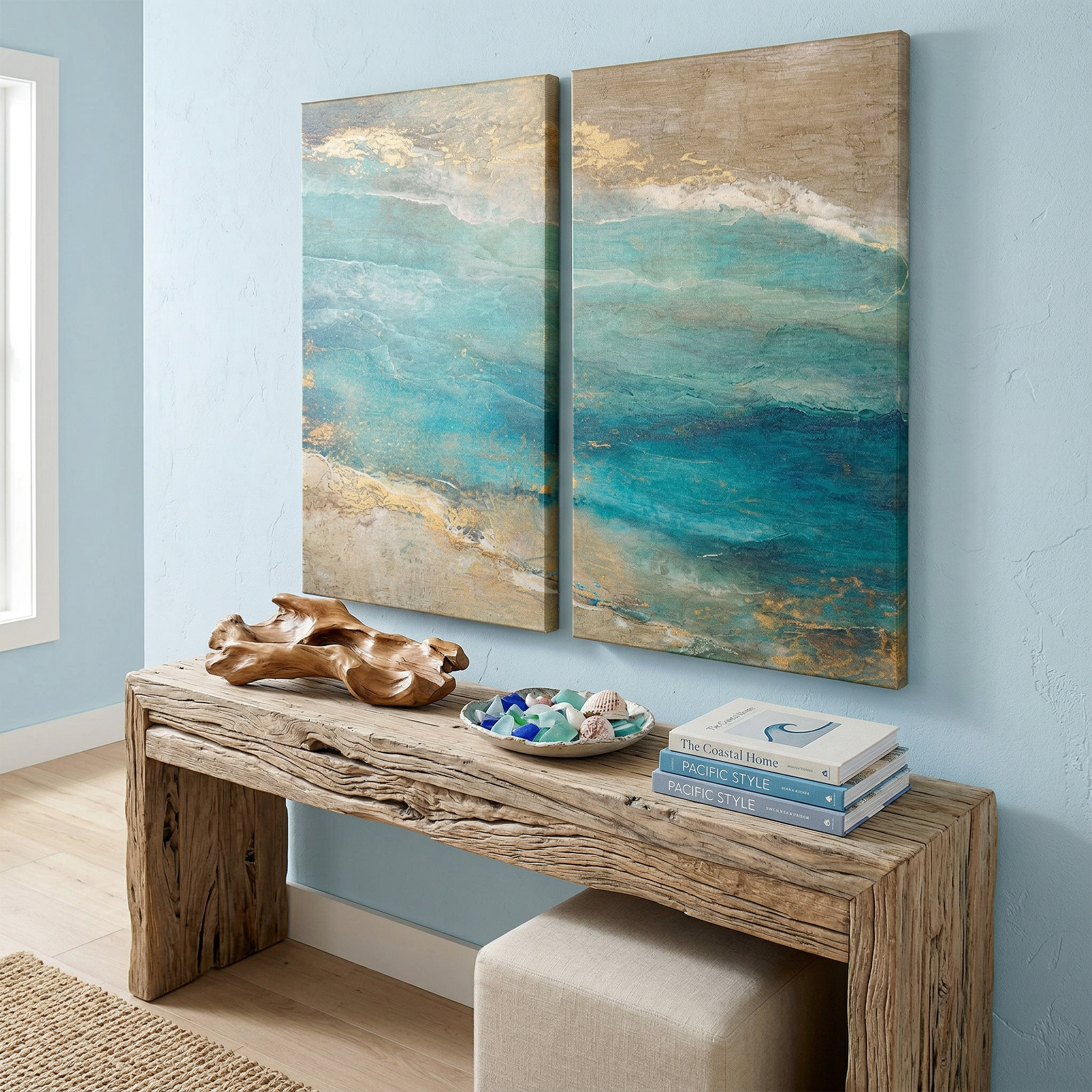 Large two-piece abstract coastal canvas wall art featuring turquoise ocean waves and gold sand textures, displayed above a blue sofa in a modern industrial living room.